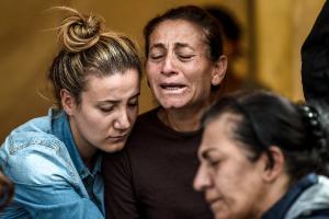 A family mourns in an area allocated for families of&nbsp;&hellip;