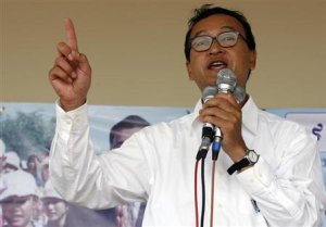 Opposition leader Sam Rainsy speaks during a rally in Kandal province