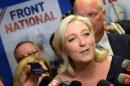 French far-right Front National (FN) party president Marine Le Pen reacts at the party's headquarters in Nanterre, outside Paris, on May 25, 2014