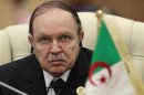 Algeria's President Bouteflika listens to speech of Libya's leader Gaddafi at the start of the third EU-Africa summit in Tripoli