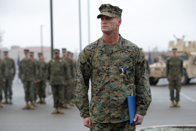 U.S. Marine Sgt. William Soutra Jr. wears the Navy Cross during a ceremony held at Camp Pendleton, Calif., Monday, Dec. 3, 2012. Soutra Jr. was awarded the medal for his heroism while serving in Afghanistan. (AP Photo/Jae C. Hong)