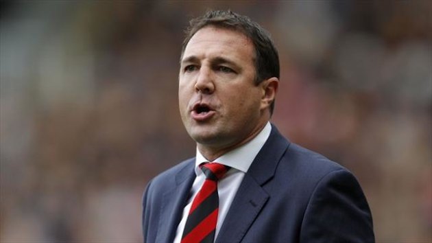 Malky MacKay gave a brief thumbs up to fans at Anfield
