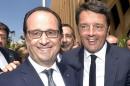 Italian PM Renzi smiles as he arrives with French President Hollande to visit the French pavilion at the Expo 2015 global fair in Milan