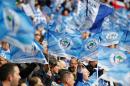 Wigan Athletic fans wave flags before the start of the English FA Cup final football match on May 11, 2013