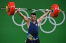 Iran's Sohrab Moradi competes during the men's weightlifting 94kg event at the Rio 2016 Olympic Games in Rio de Janeiro on August 13, 2016