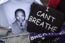 T-shirts with the image of Martin Luther King and with the words "I can't breathe" are pictured for sale during a Martin Luther King day rally in the Harlem section of New York
