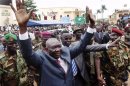 Central African Republic's new leader Michel Djotodia greets his supporters at a rally in downtown Bangui