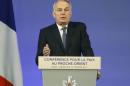 French Minister of Foreign Affairs Jean-Marc Ayrault addresses delegates at the opening of the Mideast peace conference in Paris
