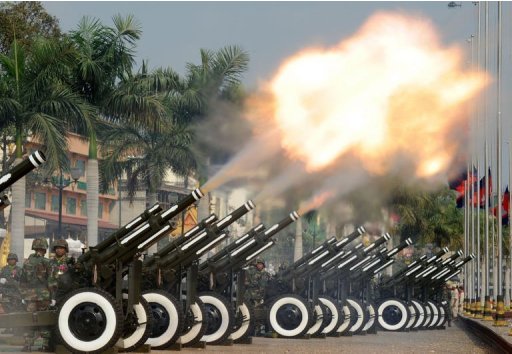 Cambodian soldiers fire a 101-gun salute during a funeral procession in Phnom Penh, on February 1, 2013