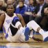 Oklahoma City Thunder forward Kevin Durant slides to the floor on a play against the Houston Rockets in the second half of NBA basketball game in Oklahoma City