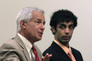 Dharun Ravi, right, listens to his attorney, Joseph Benedict during a hearing in New Brunswick, N.J., Wednesday, May 30, 2012. Ravi, a former Rutgers University student who used a webcam to watch his roommate kiss another man days before the roommate killed himself, was sentenced May 21, 2012, to 30 days in jail and three years of probation. After apologizing for the first time Tuesday, May 29, Ravi gave up his right to remain free on Wednesday while New Jersey prosecutors appeal his 30-day jail sentence. (AP Photo/Mel Evans)