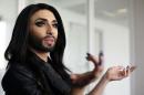 Austrian drag queen Conchita Wurst gestures during an interview with Reuters in Vienna