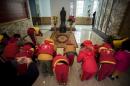 Children bowing before a statue of Confucius -- the teachings of the Chinese sage are enjoying a revival