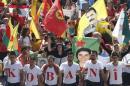 People take part in a demonstration against Islamic State insurgent attacks on the Syrian Kurdish town of Kobani, in Beirut