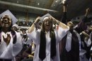 Students cheer as U.S. President Obama attends Kalamazoo Central High School graduation in Michigan
