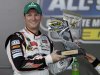 Dale Earnhardt Jr. poses with the trophy in victory lane after winning the NASCAR Sprint Showdown auto race in Concord, N.C., Saturday, May 19, 2012. (AP Photo/Chuck Burton)