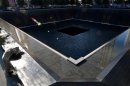Scott Willens, who joined the United States Army three days after the attacks on Sept. 11, 2001, pauses by the South Pool of the World Trade Center Memorial during the 11th anniversary observance, Tuesday, Sept. 11, 2012 in New York. (AP Photo/Justin Lane, Pool)