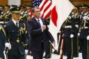 US Secretary of Defense Carter inspects honour guard before meeting with Japan's Defense Minister Nakatani at defense ministry in Tokyo