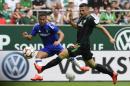 Chelsea FC's Ghanian Eden Hazard (L) and Werder Bremen's Marnon Busch vie for the ball on August 3, 2014 in Bremen, northern Germany. Bremen won the match 3-0