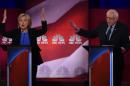 Democratic presidential candidates Hillary Clinton (L) and Bernie Sanders participate in a debate in Charleston, South Carolina
