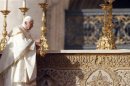 Pope Benedict XVI blesses the altar during a special mass to canonize seven new saints at St. Peter's square in Vatican City