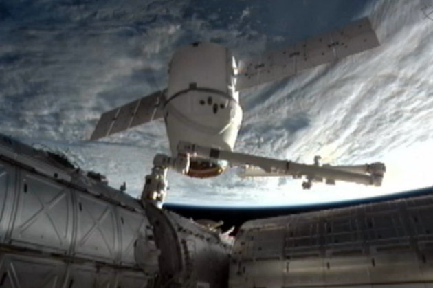 This image provided by NASA-TV shows the SpaceX Dragon commercial cargo craft as it is backed away from the International Space Station early Tuesday March 26, 2013 by the International Space Station's Canadarm2 robotic arm. The Dragon is expected to splash down in the eastern Pacific ocean approximately 246 miles off the coast of Baja Calif., later this morning. (AP Photo/NASA)