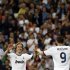 Real Madrid's Modric celebrates his goal against Malaga with teammate Benzema during their Spanish first division soccer match at Santiago Bernabeu stadium in Madrid