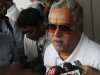 Force India team principal Vijay Mallya talks to the media in the paddock during the third practice session of the Indian F1 Grand Prix at the Buddh International Circuit in Greater Noida