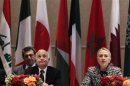 U.S. Secretary of State Hillary Clinton speaks during the Friends of Syrian People Ministerial as Arab League chief Nabil Elaraby (L) sits at the Waldorf Astoria in New York