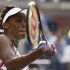 Williams of the U.S. hits a return to compatriot Mattek-Sands during their women's singles match at the U.S. Open tennis tournament in New York