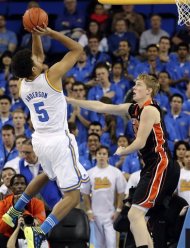 UCLA guard Kyle Anderson (5) shoots over Oregon State guard Olef Scahftenaar (30), of the Netherlands, in the first half of an NCAA college basketball game in Los Angeles, Thursday, Jan. 17, 2013. (AP Photo/Reed Saxon)
