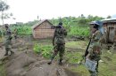 Fighters of the M23 rebel group take position in Mutaho, near Goma on June 3, 2013