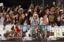 Film fans take photographs during the Marvel Avengers Assemble European Premiere