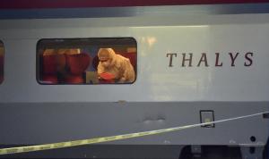 Police inspect the crime scene inside a Thalys train …