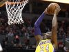 Los Angeles Lakers guard Kobe Bryant, right, goes to the basket over Portland Trail Blazers forward LaMarcus Aldridge during the first quarter of an NBA basketball game in Portland, Ore., Wednesday, Oct. 31, 2012. (AP Photo/Don Ryan)