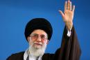 A picture released on May 6, 2015 by the official website of the Centre for Preserving and Publishing the Works of Iran's supreme leader Ayatollah Ali Khamenei, shows him waving to the crowd on May 6, 2015 in Tehran