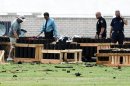 Police officials investigate a site in Simi Valley, Calif., Friday July 5, 2013 where an explosion Thursday injured more than two dozen people at a fireworks display. The explosion occurred when a wood platform holding live fireworks tipped over, sending the pyrotechnics into the crowd of spectators. (AP Photo/Nick Ut)