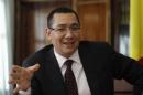Romania's Prime Minister Ponta gestures as he speaks during an interview with Reuters in Bucharest