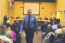 FILE - In this Feb. 11, 2014 file image from video provided by the City of Ferguson, Mo., officer Darren Wilson attends a city council meeting in Ferguson. Police identified Wilson, 28, as the police officer who shot 18-year-old Michael Brown on Aug. 9, 2014 in Ferguson. Police departments across the country are bracing for large demonstrations when a grand jury decides whether to indict Wilson. (AP Photo/City of Ferguson, File)