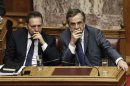 Greece's PM Samaras and Finance Minister Stournaras attend a parliament session in Athens