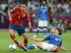Spain's Xavi Hernandez evades a tackle from Italy's Riccardo Montolivo in Sunday's final