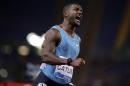 Justin Gatlin, of the United States, celebrates after winning the men's 100m event at the Golden Gala IAAF athletic meeting, in Rome's Olympic stadium, Thursday, June 4, 2015. Justin Gatlin came within 0.01 seconds of his world-leading time in the 100 meters, clocking 9.75 at the Golden Gala on Thursday. With the wind in his favor, Gatlin finished several strides ahead of the rest of the field then flexed his biceps for photographers in the finish area. (AP Photo/Andrew Medichini)