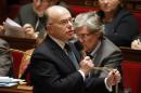 France's Interior Minister Bernard Cazeneuve replies to deputies during the questions to the government session at the National Assembly in Paris