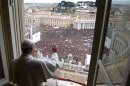 Newly elected Pope Francis appears at the window of his future private apartment to bless faithful during Angelus prayer at Vatican