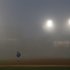 Toronto Blue Jays right fielder Jose Bautista leaves the field after a fog delay is called by the umpire crew during the third inning of a baseball game between the Chicago White Sox and the Blue Jays Monday, June 10, 2013, in Chicago. (AP Photo/Charles Rex Arbogast)