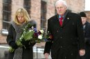 U.S. Vice President Cheney and his daughter Liz Cheney Perry walk inside Auschwitz museum.