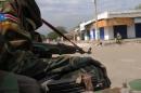 South Sudan's former rebel army the SPLA soldiers patrol in the streets of Malakal, the capital of the Upper Nile state, on January 12, 2014