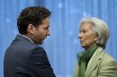 Dutch Finance Minister Jeroen Dijsselbloem, left, speaks with Managing Director of the International Monetary Fund Christine Lagarde during an extraordinary meeting of the eurogroup at EU headquarters in Brussels on Friday, March 15, 2013. European finance ministers are trying to complete a long-delayed bailout deal for Cyprus in a bid to keep the island nation from a bankruptcy that could rekindle the region's debt crisis. (AP Photo/Virginia Mayo)