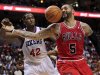 Chicago Bulls' Carlos Boozer (5) loses the ball as he is defended by Philadelphia 76ers' Elton Brand (42) during the first quarter of Game 3 in an NBA basketball first-round playoff series in Philadelphia, Friday, May 4, 2012. (AP Photo/Mel Evans)