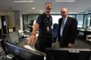 In this March 23, 2014 photo, Australian Deputy Prime Minister Warren Truss, right, talks with John Rice, senior search and rescue officer and mission coordinator for the search for the missing Malaysia Airlines Flight MH370, at rescue coordination center of the Australian Maritime Safety Authority in Canberra. Just weeks before the hunt for the missing Malaysian airliner is set to resume, an Australian official said Thursday, Aug. 28, that the sprawling search area in the southern Indian Ocean may be extended farther south based on a new analysis of a failed attempt to call the plane by satellite phone. Truss said the analysis of the call, attempted by Malaysia Airlines officials on the ground soon after Flight 370 disappeared from radar, "suggests to us that the aircraft might have turned south a little earlier than we had previously expected." (AP Photo/Graham Tidy, Pool)